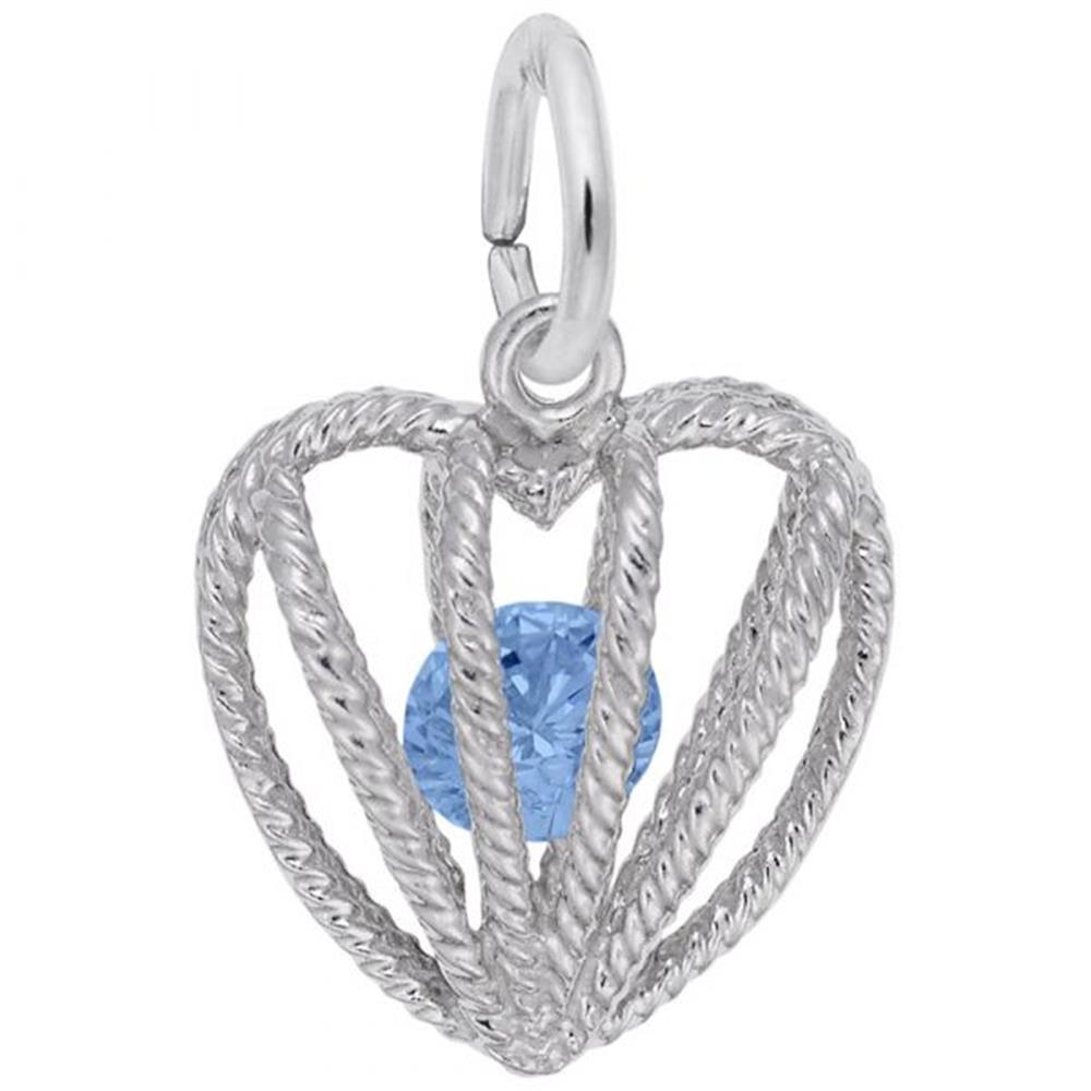 The Embraced with Love December Stone Charm by Rembrandt Charms showcases a sterling silver, heart-shaped pendant adorned with intricate wire detailing and centering a vibrant blue topaz gemstone, perfect for December birthdays. It features a loop at the top for easy attachment to a chain or bracelet.