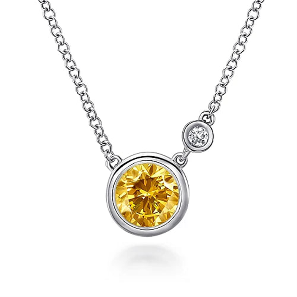 Introducing the Gabriel & Co 925 Sterling Silver Citrine and Diamond Pendant Necklace—this exquisite piece showcases a round yellow gemstone pendant complemented by a smaller, shimmering round diamond accent, all set in elegant 925 sterling silver and suspended from a delicate silver chain.
