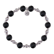 The Day by Day Collection – Onyx Gemstone Bracelet by T Jazelle features alternating large black onyx and smaller metallic silver beads with a round “KS” logo charm, making it perfect gratitude jewelry. Displayed on a white background.
