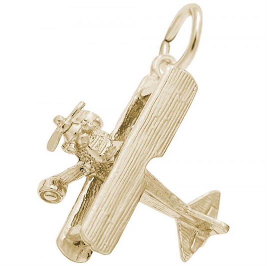 The Biplane Charm by Rembrandt Charms is a gold-plated sterling silver piece, intricately designed with features such as a propeller and textured wings. It includes a circular loop at the top for versatile use as either a pendant or keychain.