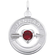 The Rembrandt Charms January Birthstone Charm in Sterling Silver is a circular pendant featuring the word "January" engraved at the top. It showcases a red, heart-shaped gemstone pierced by a silver arrow and includes intricate textured detailing on the outer ring. A small loop at the top allows for easy attachment to a chain, and it is crafted from elegant sterling silver.