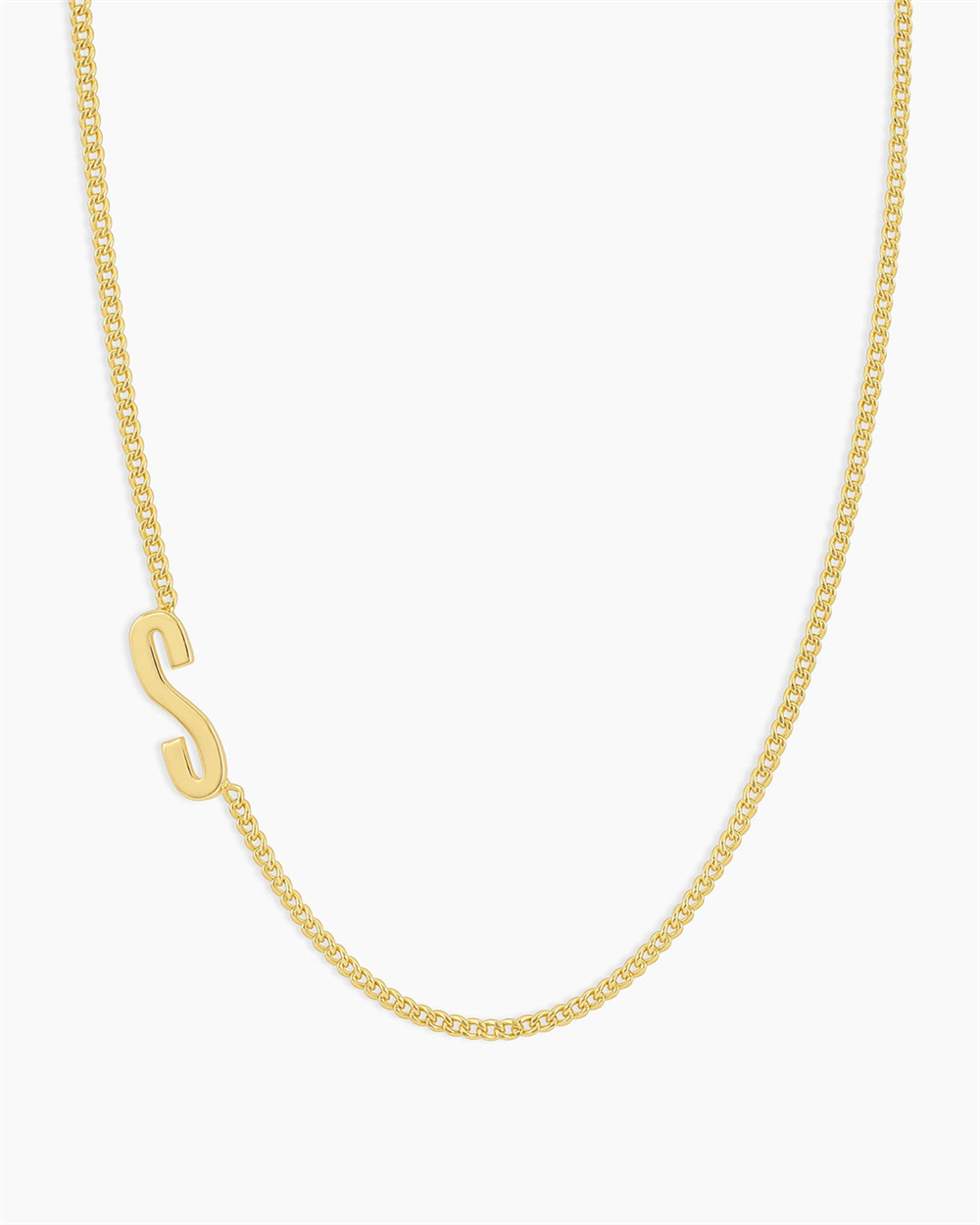 The Gorjana Wilder Alphabet Necklace - S features an 18k gold plated, minimalist chain with a single off-center "S" charm, standing out elegantly against a plain white background.