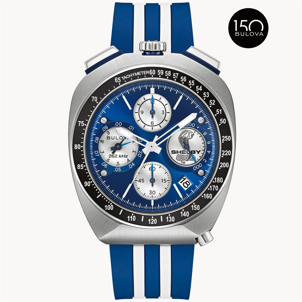The Bulova Watch Company SHELBY® Racer Chronograph features a silver and blue case, blue and white striped band, three sub-dials, "SHELBY" logo on the face, and a 150th anniversary Bulova logo at the top right.