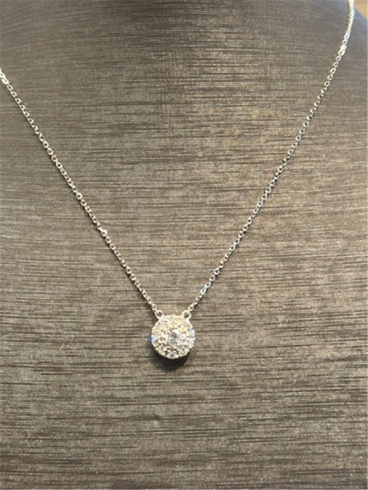 The Ryan Gems Diamond Circle Disc Pendant features a round diamond-encrusted pendant on a delicate 14k white gold chain, elegantly displayed on a gray textured bust.