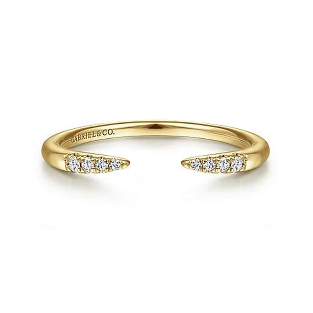 Presenting the 14K Yellow Gold Open Diamond Tipped Stackable Ring by Gabriel & Co. This elegant piece features two pointed ends adorned with shimmering diamonds, delicately curved for a refined look. Inscribed with "Gabriel & Co." on the inner band, this design from the Gabriel Stackables collection embodies simplicity and luxury.