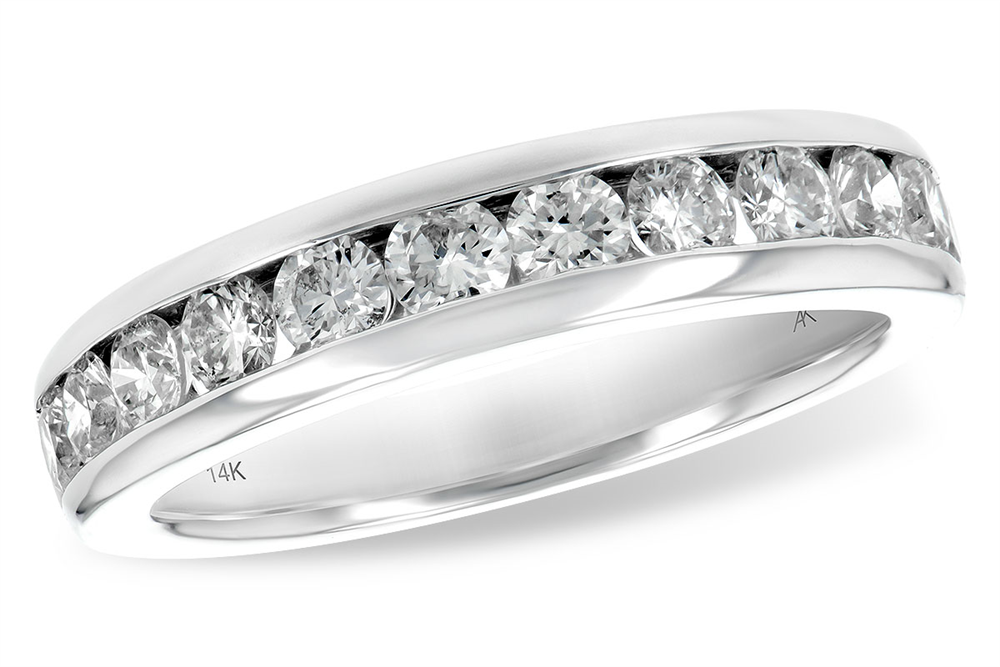 The Allison Kaufman 14k white gold channel set wedding band features a row of round-cut diamonds totaling 1 carat, elegantly arranged in a classic design with “14K” engraved on the inner band.