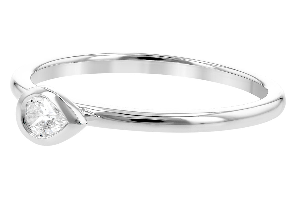 The 14K Solitaire Ring with Pear-Shape Diamond by Allison Kaufman showcases a minimalist design with a single teardrop-shaped diamond set in a sleek, polished band. The partially encased diamond catches the light beautifully, making this timeless treasure exude elegance and modernity.