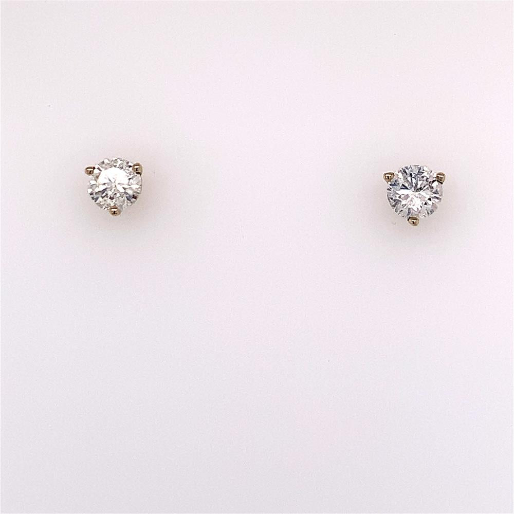 Two .7500 Ctw Diamond Stud Earrings by Diastar, LLC-Diastar against a plain, light background. Each earring features a round, brilliant-cut diamond set in a four-prong setting. The diamonds are clear and sparkly, highlighting their quality and brilliance.