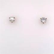 Two .7500 Ctw Diamond Stud Earrings by Diastar, LLC-Diastar against a plain, light background. Each earring features a round, brilliant-cut diamond set in a four-prong setting. The diamonds are clear and sparkly, highlighting their quality and brilliance.