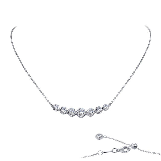 The 7 Symbols of Joy Necklace by Lafonn is a delicate sterling silver piece bonded with platinum. It features seven evenly spaced, round-cut simulated diamonds set in a fine chain with an adjustable clasp, as shown in detail in the bottom right corner of the image.