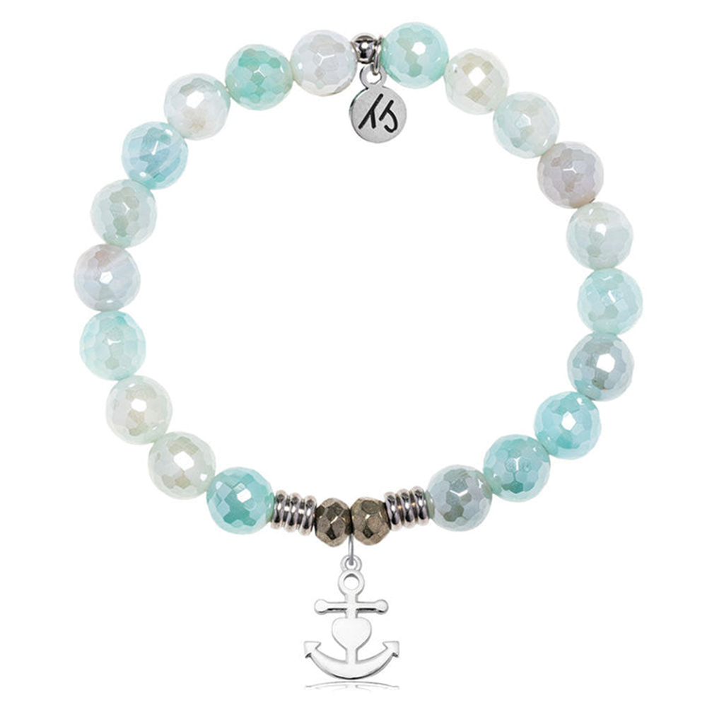 The T Jazelle Aqua Agate Gemstone Bracelet features faceted blue and white beads, silver spacers, a "Faith. Hope. Love." sterling silver charm, and a dangling silver anchor charm.
