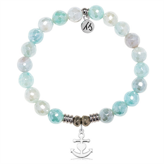 The T Jazelle Aqua Agate Gemstone Bracelet features faceted blue and white beads, silver spacers, a "Faith. Hope. Love." sterling silver charm, and a dangling silver anchor charm.
