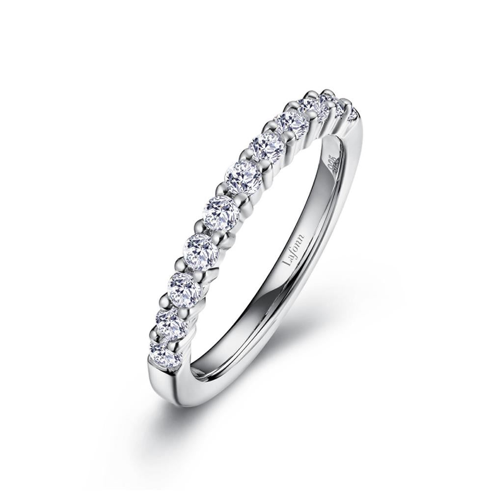The Lafonn 0.50 CTW Half-Eternity Band is a silver ring adorned with a continuous row of small, round-cut diamonds totaling 0.50 carats along the top half. The inside features engraved text, and it is displayed on a plain white background.