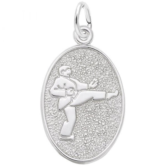 The Rembrandt Charms Martial Arts Charm in sterling silver features an image of a martial artist performing a high kick. This pendant has a textured background, an oval shape, and a small loop at the top for attaching to a chain.