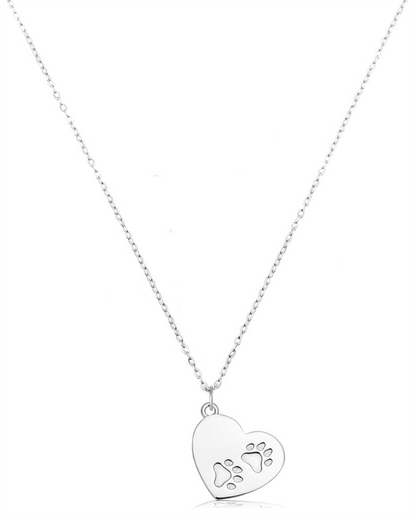 The Paws of Love Sterling Silver Charm Necklace by T Jazelle features a heart-shaped pendant with two paw print cutouts—perfect pet jewelry for expressing love on a plain white background.