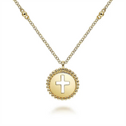 The 14K Yellow Gold Bujukan Cross Pendant Necklace by Gabriel & Co showcases a chain adorned with small, evenly spaced beads. Its round pendant features a cross cut-out design and is surrounded by a beaded edge.