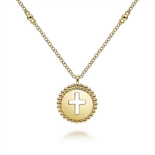 The 14K Yellow Gold Bujukan Cross Pendant Necklace by Gabriel & Co showcases a chain adorned with small, evenly spaced beads. Its round pendant features a cross cut-out design and is surrounded by a beaded edge.