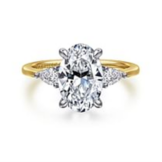 Gabriel & Co’s 14K yellow diamond engagement ring (SO:1961424) features an 11x7.2mm oval-cut center diamond with two side triangular diamonds on a simple gold band.