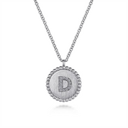 The Gabriel & Co 925 Sterling Silver Diamond Bujukan Initial D Necklace features a round pendant adorned with a "D" initial set in small, sparkling diamonds. The pendant's border boasts a Diamond Bujukan beaded edge, and it gracefully hangs from a delicate chain, showcasing an elegant and sophisticated design.