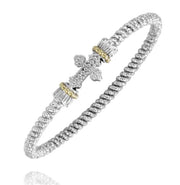 Experience the exquisite design of the Alwand Vahan Jewelry 3MM Two-Tone Closed Band (Size B4, model 23171/03). This stunning silver bracelet showcases a textured, ribbed band and a central ornate cross embellishment adorned with small gemstones. The cross is flanked by decorative cylindrical accents featuring elegant gold-toned borders, resulting in a polished and intricate design.