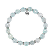 From T Jazelle’s Silver Empowered Elegance Collection, the Aqua Agate Gemstone Bracelet features round faceted pale blue and white stones with silver spacers and a signature "KS" charm.