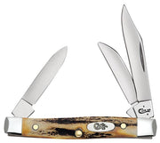 The Genuine Stag Small Stockman by W.R. Case & Sons Cutlery Co. is a folding pocket knife featuring three open blades of varying sizes. The textured, rugged handle resembles genuine stag material and displays a metal emblem with the brand's logo "Case" engraved on it. Both the blades and metal components have a polished finish.
