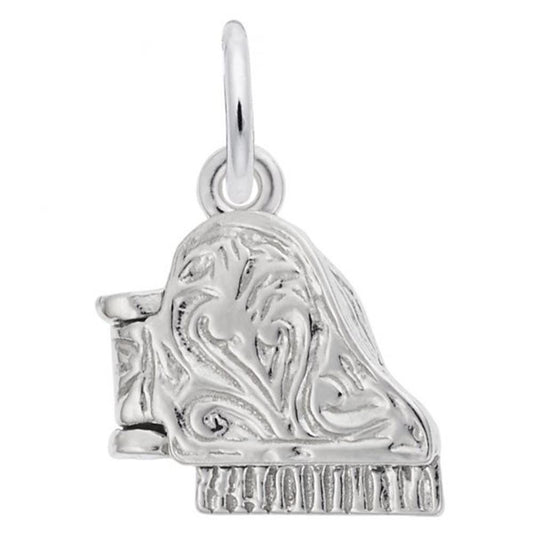 The Rembrandt Charms Piano Charm, crafted from sterling silver, is beautifully shaped like a grand piano. Its surface features intricate floral and swirling patterns. A small circular loop at the top allows it to be easily attached to a bracelet or necklace.