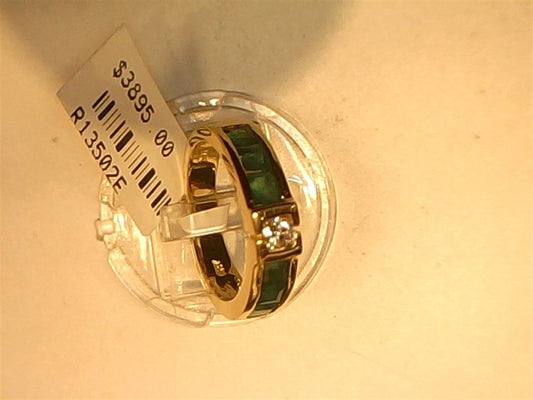 The Ryan Gems Princess Cut Emerald and Diamond Ring in 14k yellow gold, size 6.75, with green inlays and a clear gemstone, is shown on display with price $3895 and code R13502E.