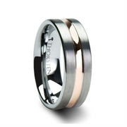 A close-up of a men's wedding band. The ZEUS Tungsten Carbide Ring by Thorsten features a brushed tungsten exterior with a polished interior inscribed with "Thorsten." It has a distinctive rose gold plated groove running through the center, combining both matte and shiny finishes.