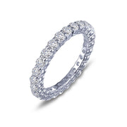 The Lafonn 1.35 CTW Eternity Band is a silver ring encircled with a continuous row of small, round diamonds totaling 1.35 carats. The sophisticated prong setting beautifully highlights the glittering diamonds throughout the entire circumference of the band. Positioned at a slight angle against a white background, this elegant piece captures timeless beauty.