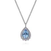 The Gabriel & Co 925 Sterling Silver Faceted Swiss Blue Topaz Pear Shape Bujukan Neck is a delicate necklace featuring a teardrop-shaped Swiss Blue Topaz pendant. The gemstone is surrounded by a detailed silver border of 925 Sterling Silver, hanging from a fine, interlinked chain. As part of the Bujukan Collection, the overall design is elegant and refined.