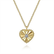 The Gabriel & Co 14K Gold Diamond and Heart Pendant Necklace boasts a central diamond pendant with sunray patterns radiating from the stone. The heart is elegantly encircled by intricate Bujukan beading, and the detailed link design of the chain flawlessly complements the pendant.