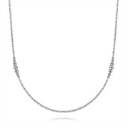 The Gabriel & Co 925 Sterling Silver Station Necklace (Serial No: S1746123, Size: 32) is a minimalist masterpiece from the Bujukan Collection. It features a thin, delicate chain adorned with small clusters of evenly spaced beads symmetrically positioned away from the center, creating a balanced and elegant design. Expertly crafted jewelry presented against a white background.