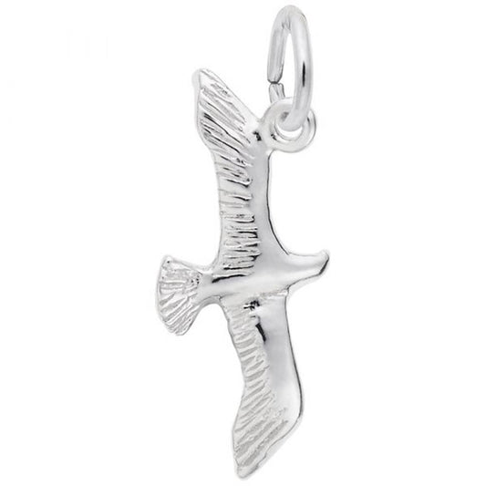 A Seagull Charm in sterling silver from Rembrandt Charms, featuring intricate engravings on the wings and tail similar to those found in their collection. This charm is shaped like a seagull in mid-flight and is attached to a small, circular loop for easy attachment to a chain or necklace.