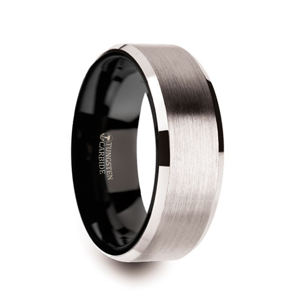 A Thorsten VEGA White Tungsten with Black Interior Ring - 8mm, featuring a brushed silver exterior and polished black interior with beveled edges. The inner surface is smooth, engraved with "Tungsten Carbide," and available in size 10. The design is modern and sleek.