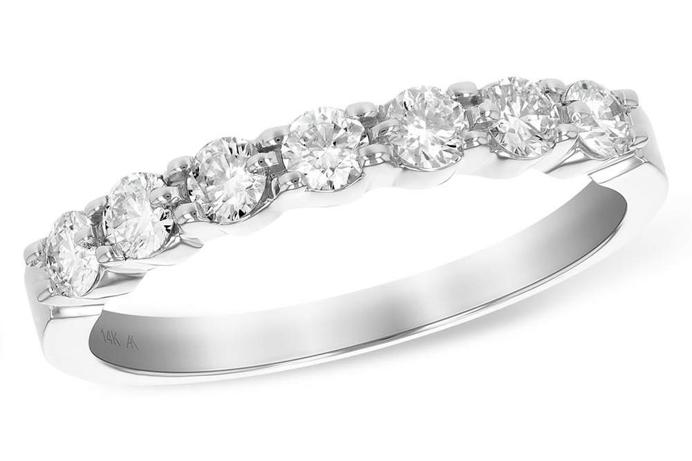A close-up image of the Allison Kaufman Ladies Diamond Wedding Ring shows it adorned with seven round-cut diamonds, totaling 0.50 carat, set in a row along the white gold band. The ring is marked with "14K" indicating its karat value. The design is elegant and classic, highlighting the sparkling diamonds.