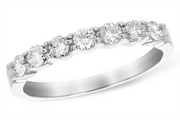 A close-up image of the Allison Kaufman Ladies Diamond Wedding Ring shows it adorned with seven round-cut diamonds, totaling 0.50 carat, set in a row along the white gold band. The ring is marked with "14K" indicating its karat value. The design is elegant and classic, highlighting the sparkling diamonds.