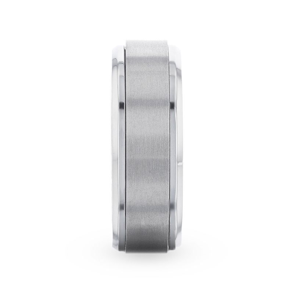 A sleek, silver metallic ring from Thorsten's REBELLION collection is shown in a side view. The 8mm Titanium ring features a spinning brushed center band, flanked by glossy edges. The clean, modern design gives the ring a contemporary and sophisticated appearance with a hint of rebellion.