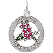 The North Carolina Azalea Charm by Rembrandt Charms is a round, sterling silver charm displaying a ring that reads "North Carolina." Inside the ring, there is an enamel design of a pink dogwood flower with green leaves, inspired by the North Carolina Azalea. A small loop is attached to the top for easy hanging.
