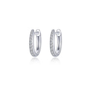 Lafonn's "Huggies" are elegant silver hoop earrings, encrusted with sparkling diamonds. These hoops delicately designed to catch the light add sophistication and are displayed on a plain white background.