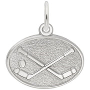 A detailed image of the Sterling Silver Hockey Oval Disc Charm by Rembrandt Charms. This charm features a polished oval disc with an intricately detailed hockey design, measuring 0.76 inches by 0.55 inches (19.29 mm by 13.97 mm). The charm has a sleek sterling silver finish, perfect for adding a touch of sporty elegance to any charm bracelet or necklace. Style number 3404.