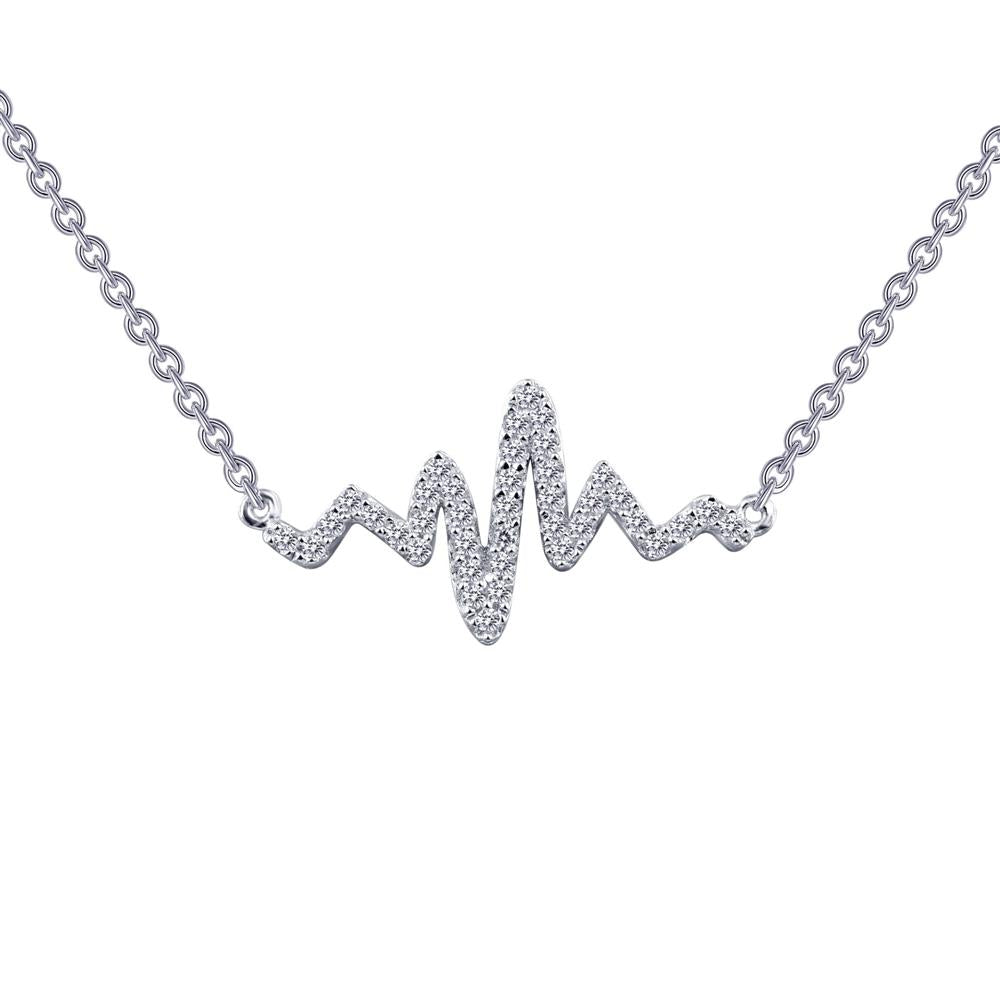 The Heartbeat Necklace by Lafonn is a sterling silver necklace featuring a pendant in the shape of a heartbeat line, adorned with small, sparkling diamonds. The pendant is attached at two points to a delicate silver chain, making it the perfect accessory for an elegant touch.