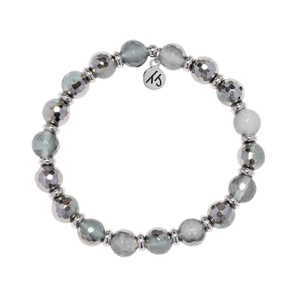 The T Jazelle Silver Empowered Elegance Collection – Blue Silver Agate Gemstone Bracelet features handmade alternating gray and silver faceted beads, silver spacers, and a round charm engraved with "KS.