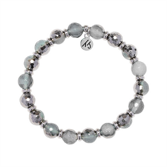 The T Jazelle Silver Empowered Elegance Collection – Blue Silver Agate Gemstone Bracelet features handmade alternating gray and silver faceted beads, silver spacers, and a round charm engraved with "KS.
