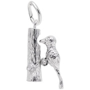 The Rembrandt Charms Woodpecker Charm / Sterling Silver features a detailed woodpecker perched on the side of a vertical tree trunk. This sterling silver pendant includes a loop at the top for attaching to a chain or bracelet, and showcases intricate texturing on both the bird and the tree trunk.