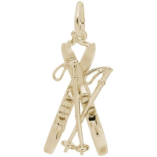 The Rembrandt Charms Downhill Skis With Poles Charm, crafted in 14K yellow gold, features a detailed design of crossed skis and ski poles. The high-quality charm showcases intricate details such as the bindings and loops on the poles, enhancing its realistic appearance. It includes a small loop at the top for easy attachment to a chain.