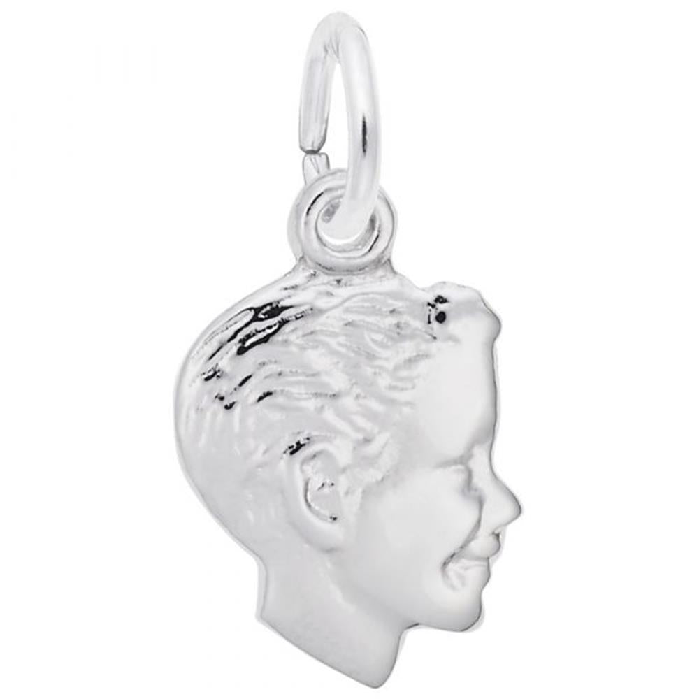 The Boys Head Small Charm by Rembrandt Charms is a sterling silver pendant that showcases the profile of a smiling child's head, complete with detailed features and textured hair. This elegant charm is attached to a small circular ring, making it perfect for threading onto either a necklace or bracelet.