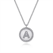Introducing the Gabriel & Co 925 Sterling Silver Bujukan Diamond Initial "A" Necklace, serial number S. This exquisite piece features a round pendant with a beaded edge, showcasing the letter "A" encrusted with small, sparkling crystals and is delicately suspended from a fine chain.