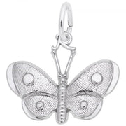 The Spotted Wings Butterfly Charm in sterling silver by Rembrandt Charms features an intricately detailed design with a textured pattern on the wings and body. It has a circular loop at the top for easy attachment to a chain or bracelet, with delicate etchings that add depth and dimension characteristic of Rembrandt Charms.