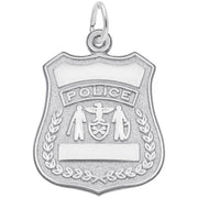 The Rembrandt Charms Police Badge Charm in sterling silver features intricate designs. The top displays the word "POLICE" with a blank space below, accompanied by two figures flanking a central shield. Another blank space is located at the bottom.